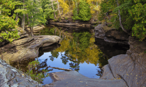 Fall colors reflected in a lagoon in the Porcupine Mountains State Park in Michigan's Upper Peninsula wilderness