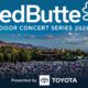 Promotional banner for RedButte Outdoor Concert Series 2026, with a large outdoor crowd and Toyota as presenter.