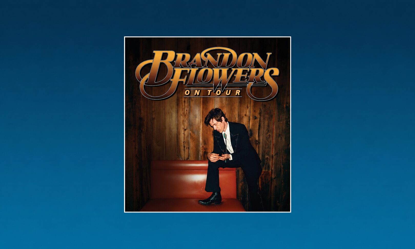Brandon Flowers On Tour poster featuring a man in a suit posing on a red bench against wooden panel backdrop.